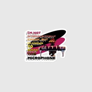 May include: A sticker featuring a cartoon character playing a keyboard. The character is brown with a red hat. Text on the sticker reads "I'm not intergalactically known, but I'm known to rock the microphone."