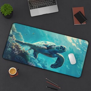 May include: A blue and green sea turtle swims in a turquoise ocean with coral reefs. The turtle is in focus and the background is blurred. This is a mouse pad with a sea turtle design.