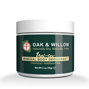 May include: A white jar with a green label that reads "OAK & WILLOW Naturally Dry, Naturally Fresh Uni-sex MINERAL BODY DEODORANT Chemical + Additive-Free Net Wt 2 oz (56g) e".