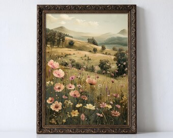 Puede incluir: Una lámina de arte enmarcada que muestra un paisaje de colinas onduladas, montañas lejanas y un prado lleno de flores silvestres rosas, amarillas y blancas. El marco es de color marrón oscuro con un patrón ornamental en relieve.