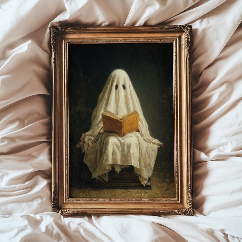 May include: A framed oil painting depicting a figure draped in a white sheet, resembling a ghost, sitting and reading an open tan book. The artwork is enclosed in an ornate, metallic gold-toned rectangular frame with intricate carved detailing.