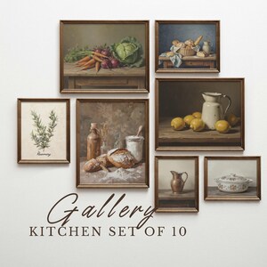 May include: A gallery wall art set of 10 framed kitchen prints. The prints feature still life paintings of vegetables, bread, lemons, and herbs. The text "Gallery Kitchen Set of 10" is below the prints.