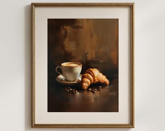 May include: A framed print featuring a still life of a cup of coffee with foam, a croissant, and scattered coffee beans. The artwork has a warm, brown color palette and a soft, painterly style, evoking a cozy cafe atmosphere.
