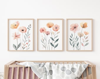 May include: Three framed watercolor prints featuring a floral design with pink and orange flowers and green leaves.