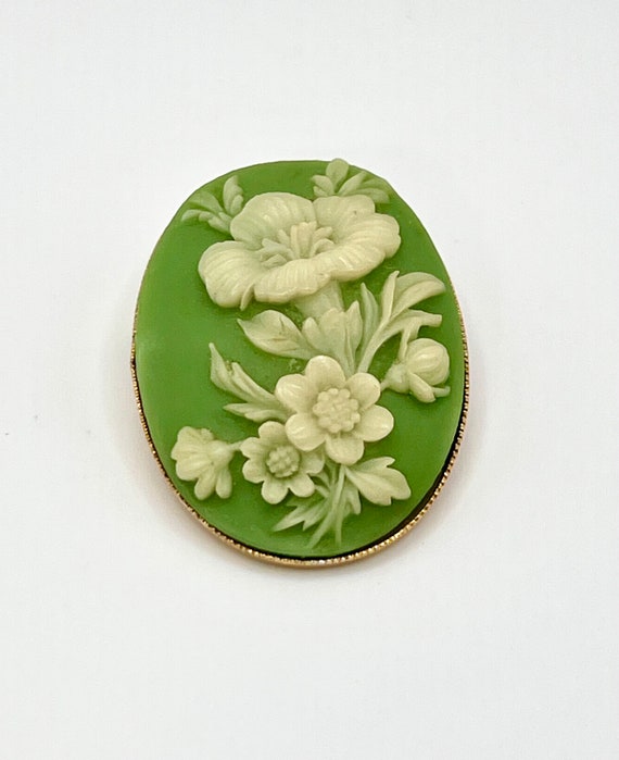 White Floral Cameo on Green Field - image 1