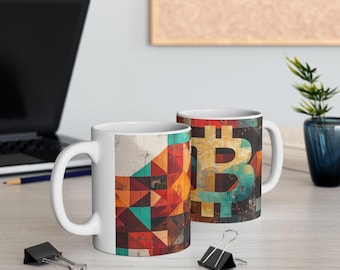 May include: Two white ceramic mugs with geometric designs. One mug features a colorful abstract pattern, while the other has a stylized Bitcoin symbol in yellow, blue, and green.