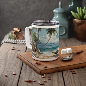 May include: White travel mug with a colorful image of a tropical beach scene with palm trees, a hammock, and blue ocean waves.