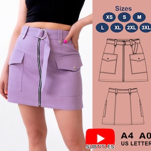 May include: A purple mini skirt with a zipper down the front and two large pockets on the sides. The skirt has a belt with a silver buckle. The image also shows a size chart with sizes XS, S, M, L, XL, 2XL, and 3XL.