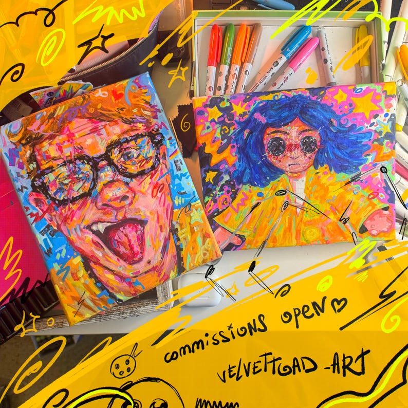 May include: Two colorful acrylic paintings of expressive faces, one with glasses and tongue out, the other with blue hair. A box of markers and the text "commissions open" and "VELVETTOAD ART" are also visible.