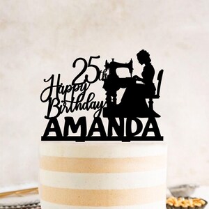 a birthday cake with a silhouette of a woman and a sewing machine