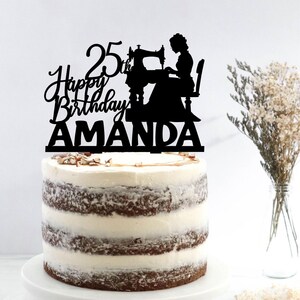 a birthday cake with a silhouette of a woman and a sewing machine