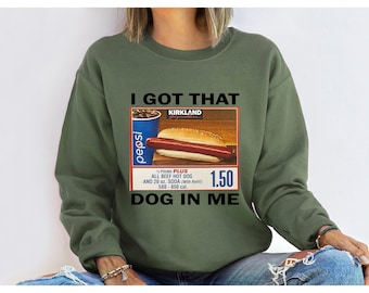 May include: Green sweatshirt with a graphic of a hot dog and a soda with the text "I got that dog in me".