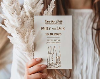 May include: A cream-colored wedding invitation card with the text "Save the Date" and the names "Emily and Jack" in brown. The date "10.10.2025" is also displayed. The card features a line drawing of two pairs of legs and cowboy boots.