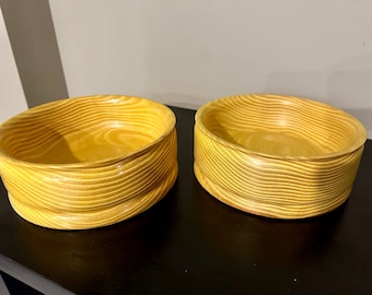 Matching set of hand turned Osage orange wooden bowls.