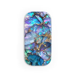 May include: A rectangular phone case with a blue, purple, and gold iridescent pattern. The pattern resembles a mosaic of seashells.