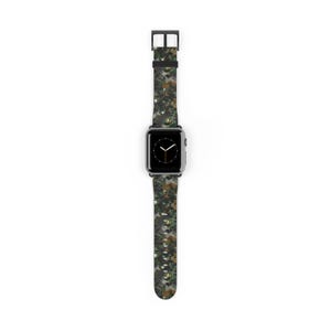 May include: A smartwatch with a camouflage-patterned strap. The strap features a mix of green, brown, and tan colours. The watch face is black with white hands. The watch case is black. The strap is made of a durable material.