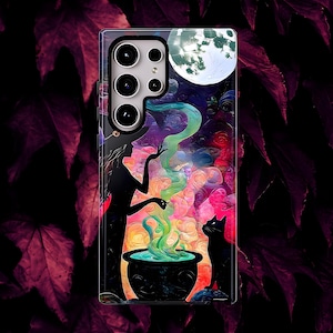 May include: A phone case featuring a witch silhouette, a black cat, and a cauldron with green smoke against a colorful, swirling background. A full moon is visible in the upper right corner. The case has a glossy finish.