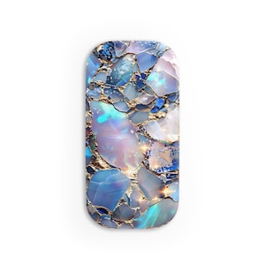 May include: A close-up of a blue and gold patterned phone case. The case is made of a hard plastic material and has a geometric design.