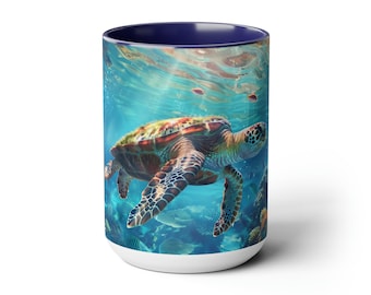 May include: A white ceramic mug with a blue rim features a colorful sea turtle swimming in a turquoise ocean with coral and fish. The mug is perfect for enjoying a hot beverage.