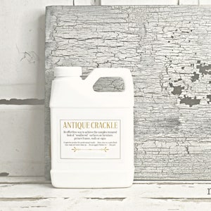 May include: A white plastic bottle with a gold label that reads "Antique Crackle". The label describes the product as an effortless way to achieve a weathered look on furniture, picture frames, walls, or signs.