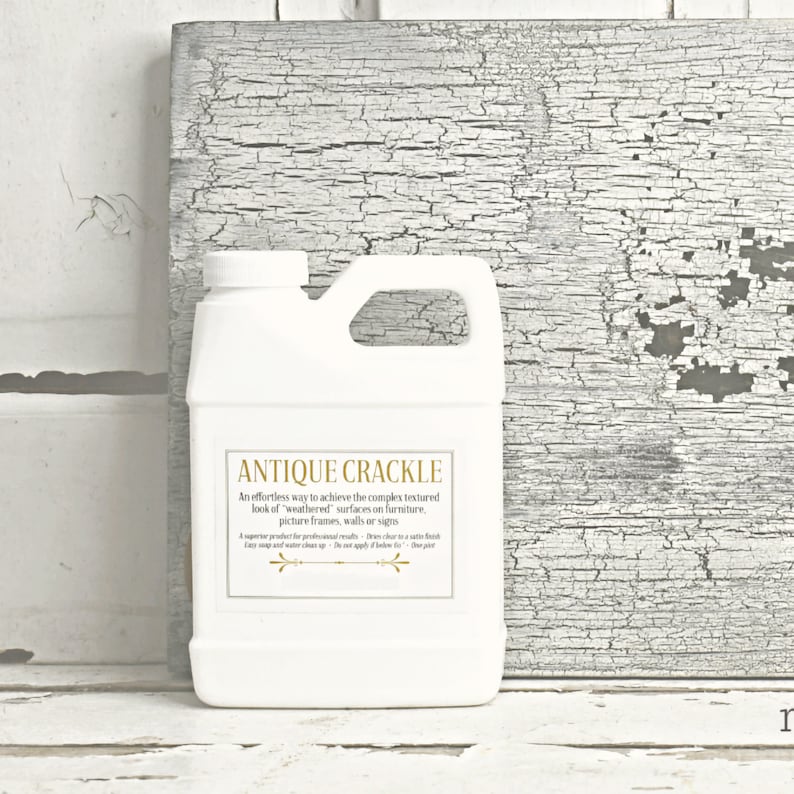 May include: A white plastic bottle with a gold label that reads "Antique Crackle". The label describes the product as an effortless way to achieve a weathered look on furniture, picture frames, walls, or signs.