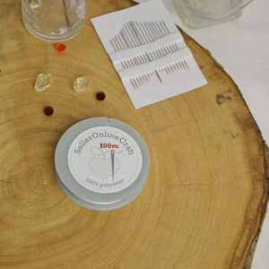 a clock sitting on top of a wooden table