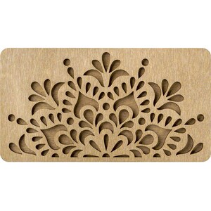 a wooden stamp with an intricate design on it