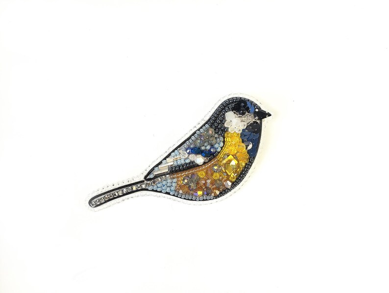a picture of a bird made out of mosaic tiles