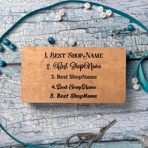 a wooden business card sitting on top of a table