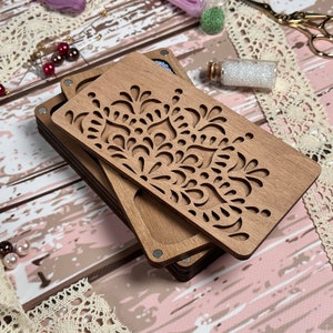 a couple of wooden coasters sitting on top of a table