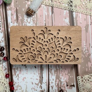 a piece of wood with a design on it