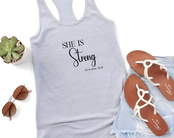 SHE IS Strong Racerback Tank Top: Motivational Workout Apparel.