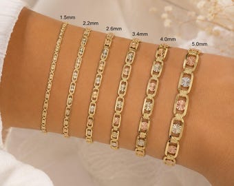 May include: Six gold bracelets of varying widths, from 1.5mm to 5.0mm, are displayed on a wrist. The bracelets feature different link designs, some with starburst and oval patterns. The gold has a polished finish, and some bracelets have tri-color accents.