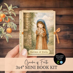 May include: A Garden of Faith mini book kit featuring a 3x4 inch book with a cover illustration of a figure in a blue headscarf holding a baby. The spine and a label on the front cover both display the text Garden of Faith in a serif font.