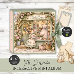 May include: A square interactive mini album titled The Little Dressmaker featuring a cover illustration of a dressmaker shop with a character holding fabric rolls. The album includes a sage green ribbon closure, two decorative cards, and a pincushion.