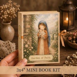 May include: A 3x4 inch mini book kit with a cover illustration of a woman in a blue veil holding a baby. The book is titled "Garden of Faith" and is tied with a gold ribbon. The cover art depicts a serene outdoor scene.