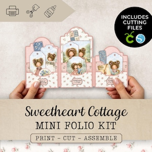 May include: A pink floral mini folio kit featuring illustrations of girls and the text "Sweetheart Cottage". The kit includes cutting files and instructions to print, cut, and assemble the folio.
