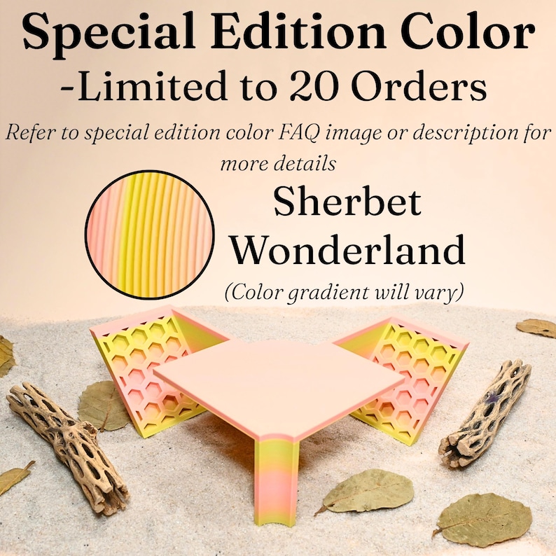 May include: A pink and yellow geometric display stand with the text "Special Edition Color - Limited to 20 Orders" and "Sherbet Wonderland". The stand is on a sandy surface with dried leaves and wood.