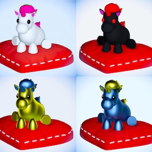 May include: Four colorful unicorn figurines, each resting on a red heart-shaped pillow with white stitching. The unicorns vary in color: white with pink, black with red, gold with yellow, and blue with gold. The background is a gradient of blue.