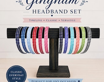 May include: A Gingham Headband Set displayed on a dark wooden stand. The headbands feature a variety of colors, including navy, blue, red, pink, and green, all with a classic checkered pattern. The text reads "Gingham Headband Set".