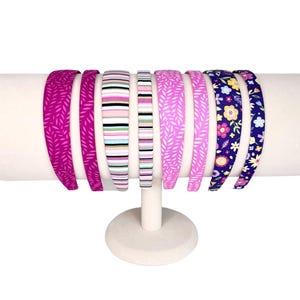 Headbands 1/2” and 1” women or girls covered in pink, blue, and stripes.