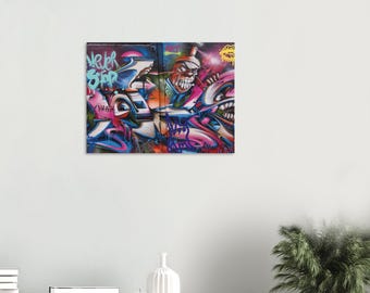 May include: A colorful graffiti mural with a cartoon character with a large mouth and the words "Never Stop" in blue and green.