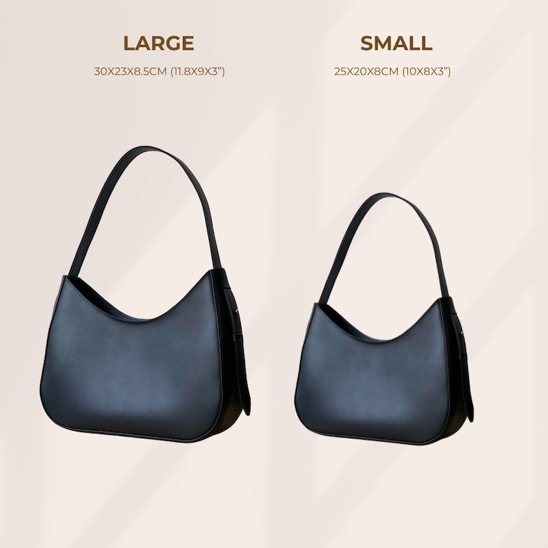 Puede incluir: Se muestran dos bolsos negros de hombro, uno grande y otro peque&ntilde;o. El bolso grande mide 30x23x8,5 cm, el peque&ntilde;o 25x20x8 cm. Ambos bolsos tienen un dise&ntilde;o curvo y una sola correa para el hombro.
