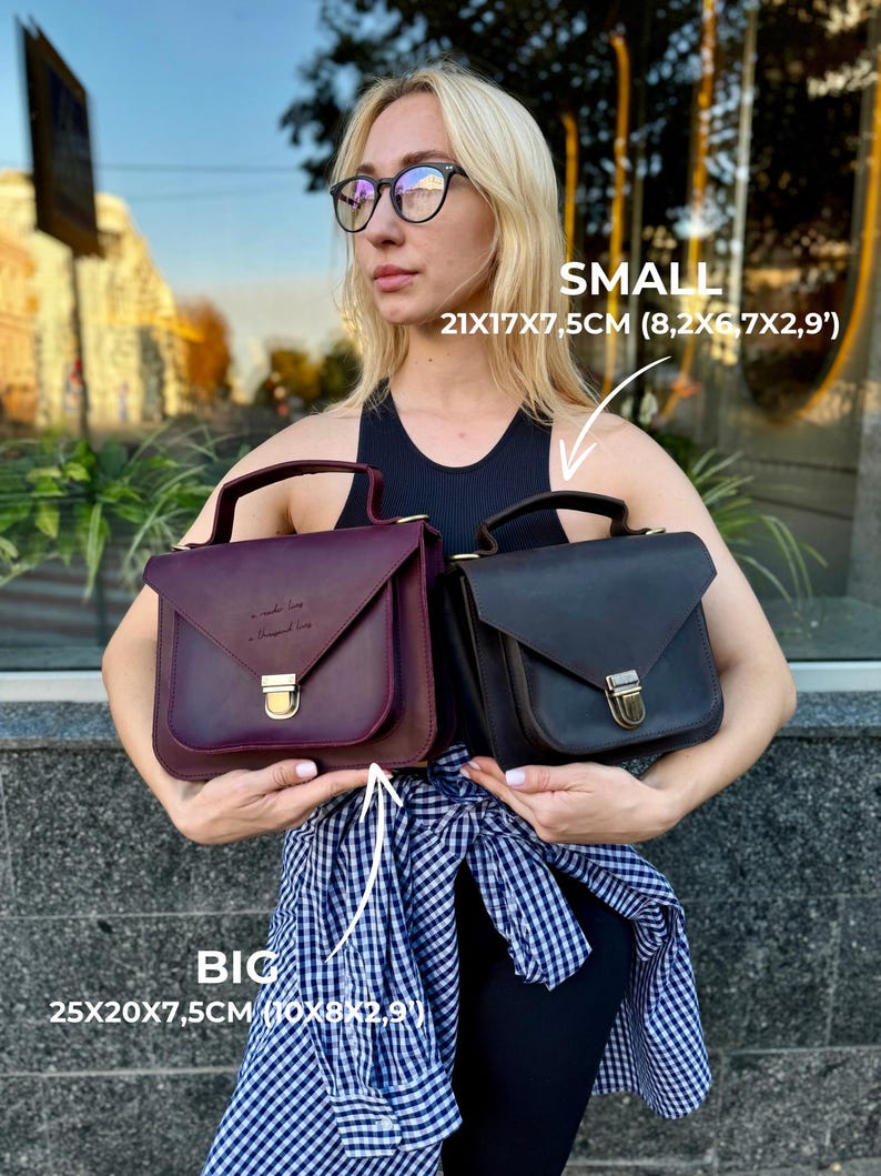 May include: Two leather handbags, one burgundy and one black, are displayed. The burgundy bag is labeled "BIG" and measures 10x8x2.9 inches. The black bag is labeled "SMALL" and measures 8.2x6x2.9 inches. Both have a handle and a gold-colored clasp.