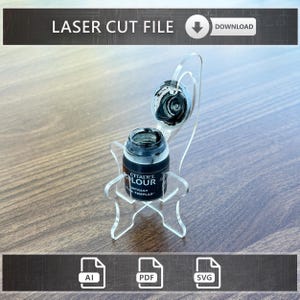 May include: Clear acrylic paint bottle holder with a bottle of Citadel Colour Contrast paint. The holder is designed to display the paint bottle and a color swatch. The text "LASER CUT FILE" and "DOWNLOAD" are visible.