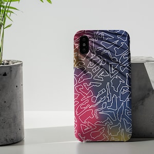 May include: A phone case with a colorful abstract design featuring white outlines of race tracks. The background is a gradient of pink, purple, and yellow.