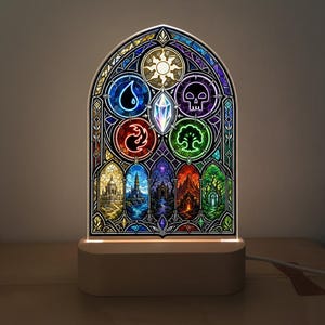May include: An arched, illuminated acrylic panel featuring a stained-glass style design. The top section displays five circular icons representing a sun, water drop, skull, flame, and tree, surrounding a central crystal. The base is a light wood block.