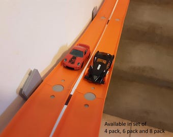 8 pack, Removeable double racetrack wall mounts. Compatible with Hot Wheels track system.