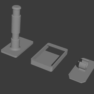 Könnte beinhalten: Ein Set aus drei grauen 3D-gerenderten Objekten, bestehend aus einem vertikalen zylindrischen Pfosten auf einer rechteckigen Basis, einem hohlen rechteckigen Rahmen mit offener Mitte und einer kleinen rechteckigen Basis mit einem Clip.