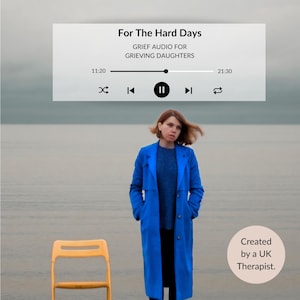 May include: A woman in a long blue coat stands near a yellow chair, with a seascape background. A digital audio player interface displays the text "For The Hard Days: Grief Audio for Grieving Daughters." Created by a UK Therapist.